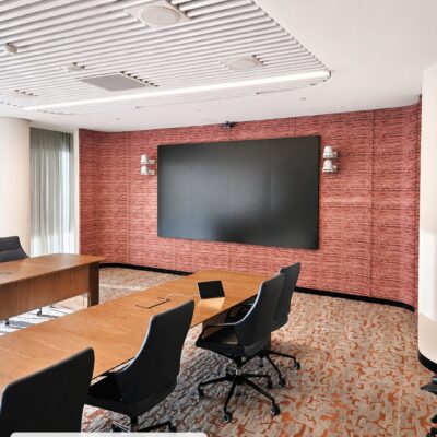 Curved acoustic wall in Autex QuietSpace 25mm fabric-wrapped in Willie Weston Durrmu, Geo, in a boardroom at BHP Brookfield Place, Perth
