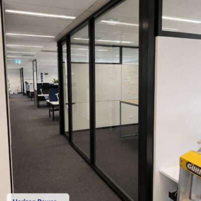 Black-framed custom acoustic glazing suite and door to a meeting room at Horizon Power, Perth