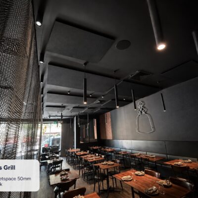 Autex QuietSpace 50mm Nude Black acoustic ceiling and wall panels in the dining room at Meninas Grill