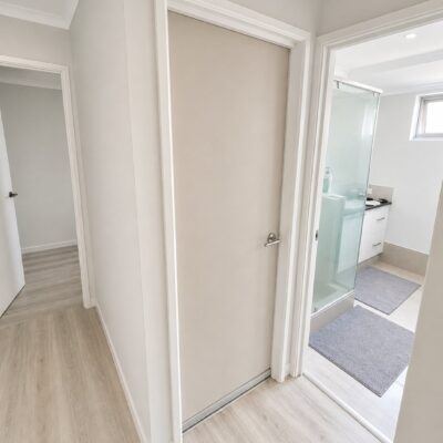 Custom acoustic RW36 hinged door fitted to a bedroom in a Perth home