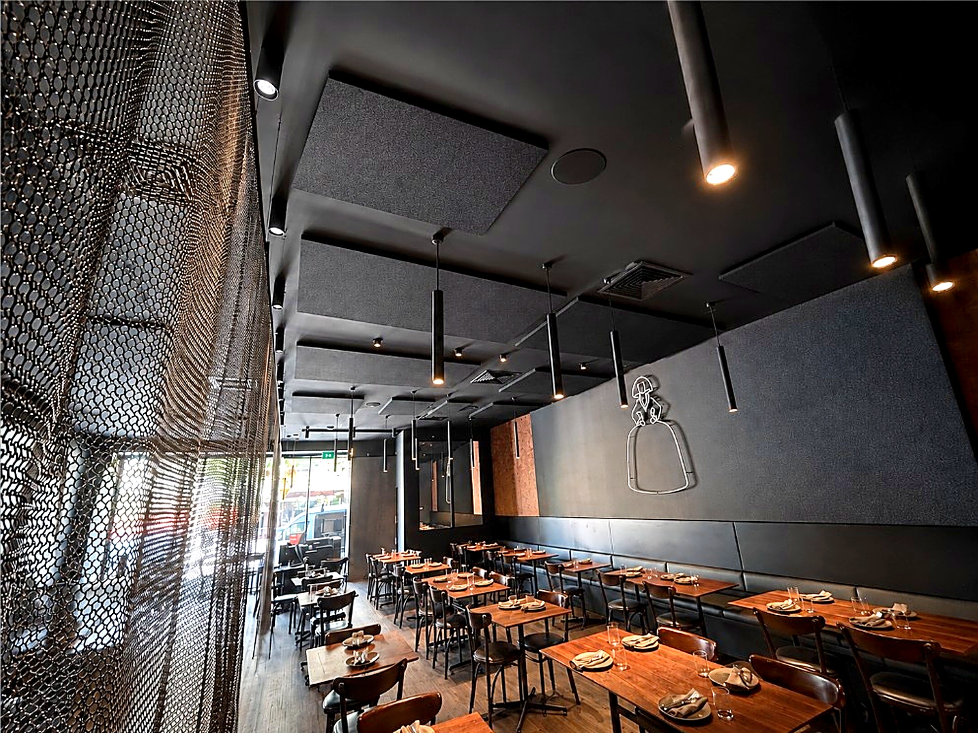 Meninas Grill dining room in Highgate, with acoustic ceiling panels by Quash Soundproofing.